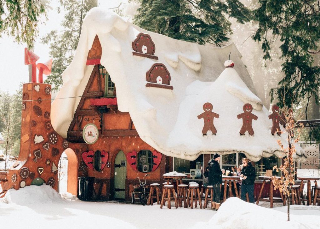A picture of a giant snow-covered gingerbread home in Lake Arrowhead.