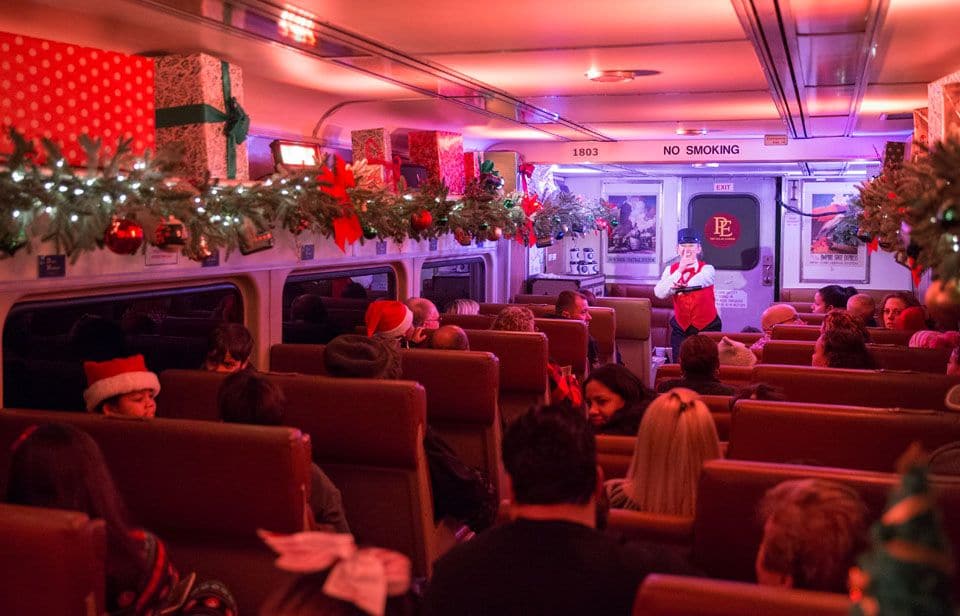 A train car in the SoCal Polar Express decked out with holiday wreaths.