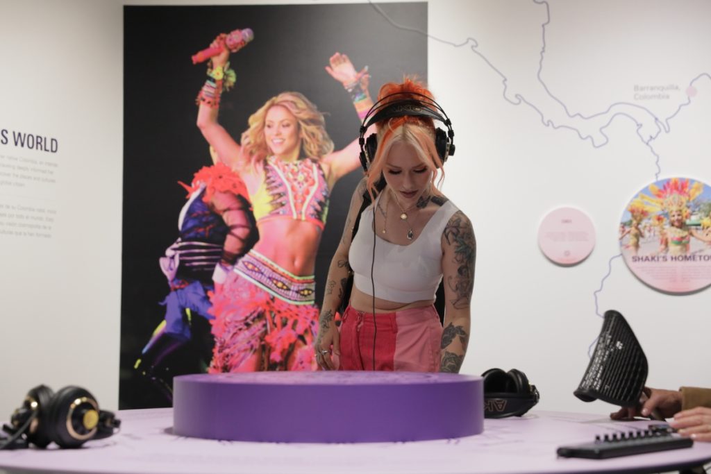 A woman examines the Shakira exhibit