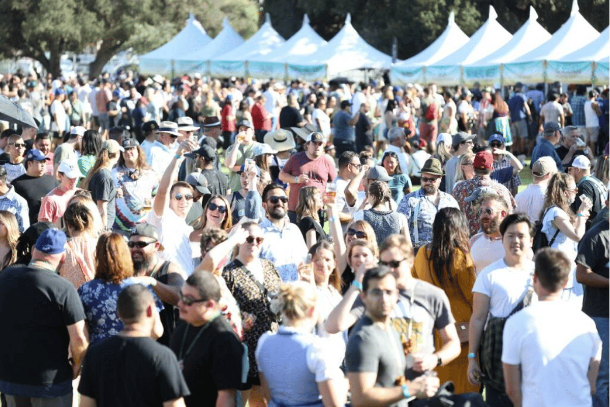 A crowd of people at a beer festival