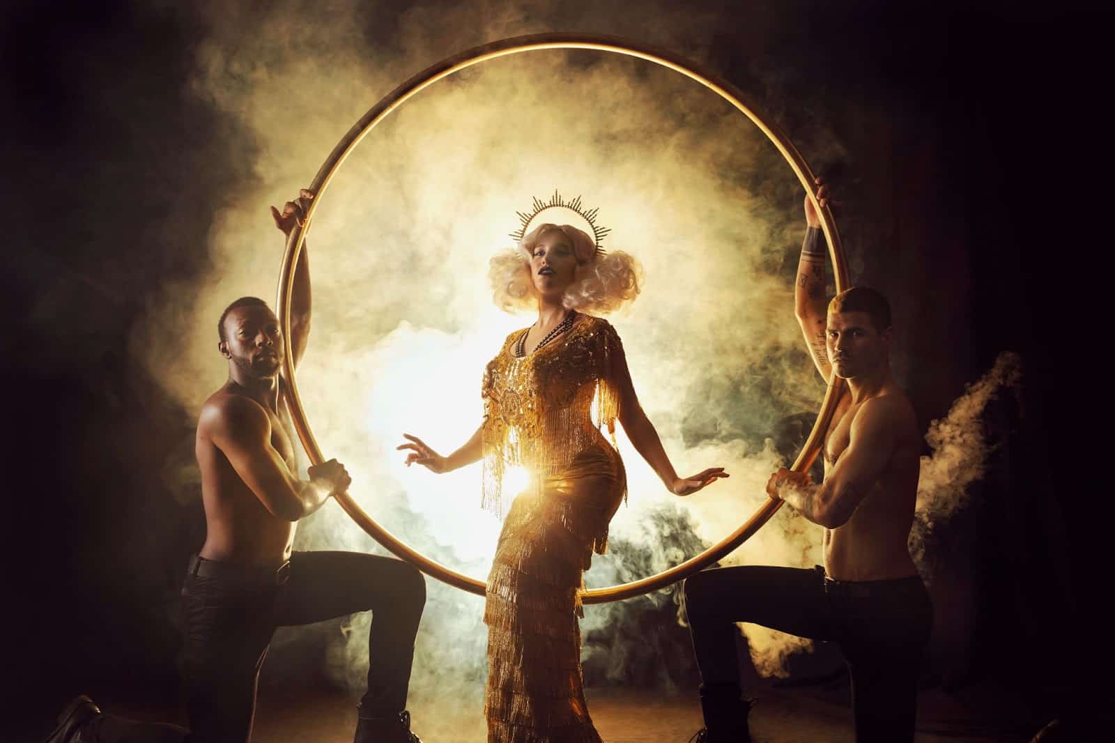 A dancer stands in the middle of a ring