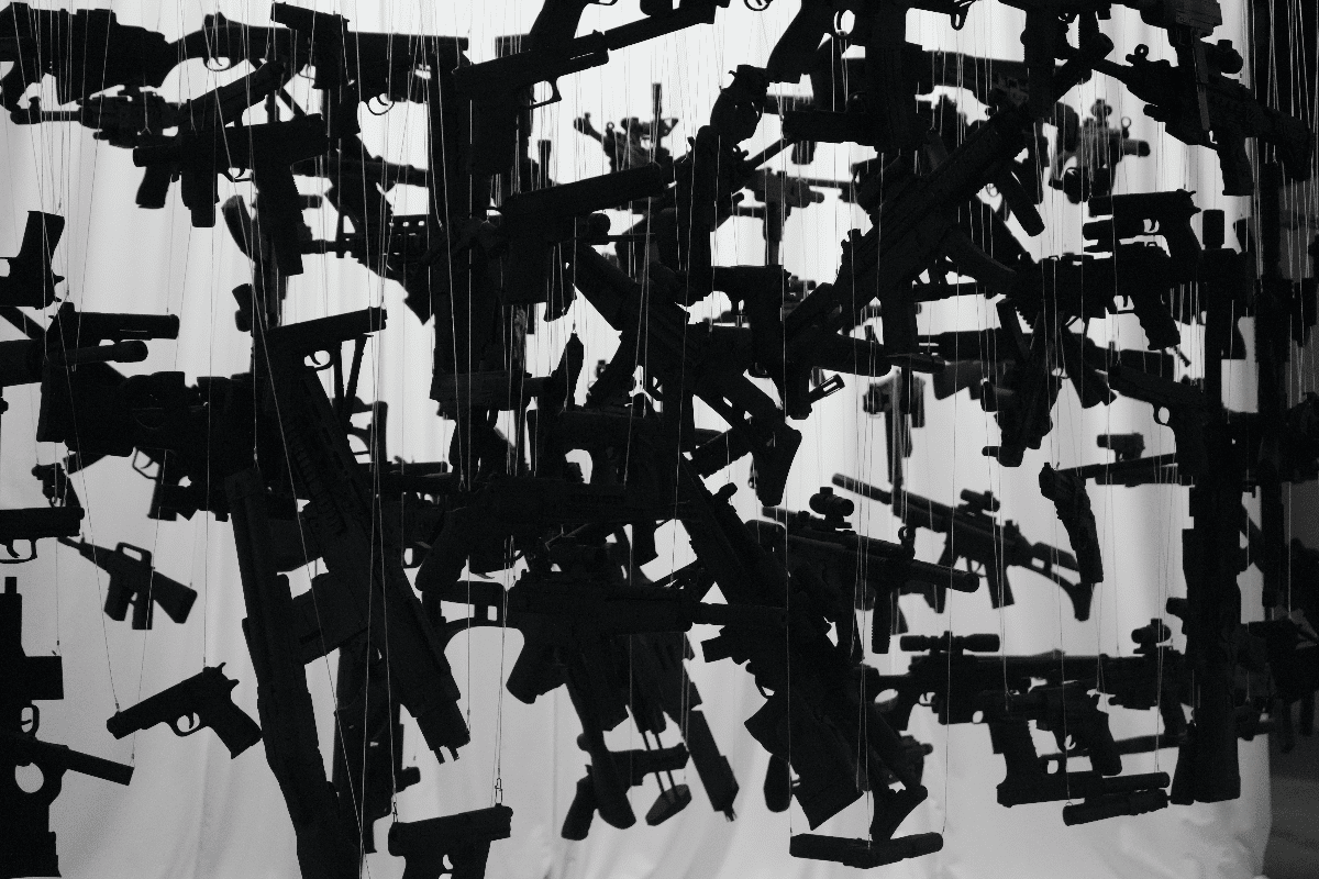 Guns hang from the ceiling in an art sculpture