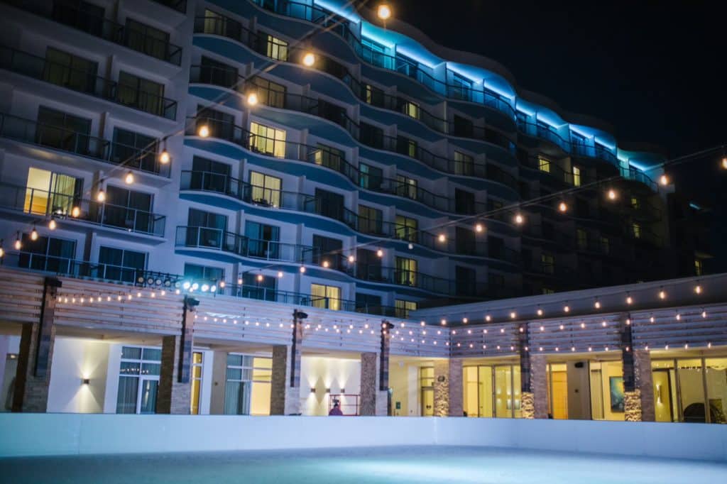 Photo of Pasea Hotel's oceanfront ice rink at night