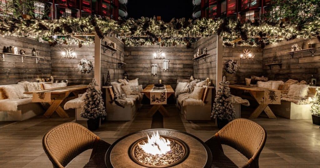 Luxurious Swiss-style chalets at the Fairmont Plaze holiday apres-ski pop-up.
