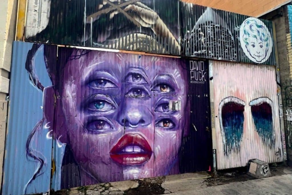 A mural of a woman with six eyes