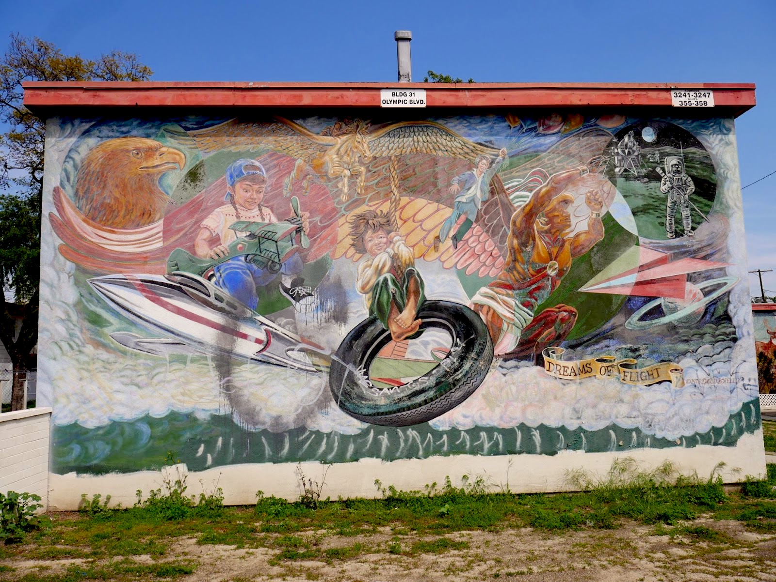 A mural called Dreams of Flight showing children at play