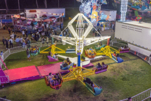 A fair with lit-up rides