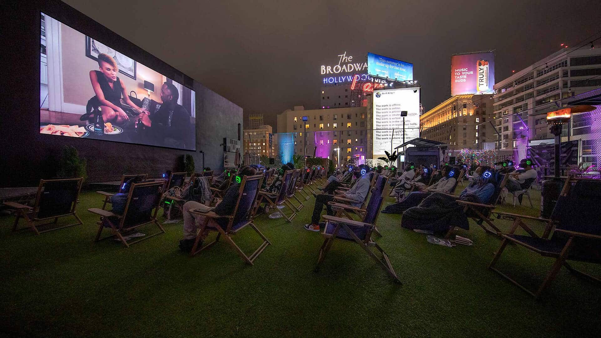 A nighttime outdoor movie screening on the rooftop of The Montalban Theatre in Hollywood. 