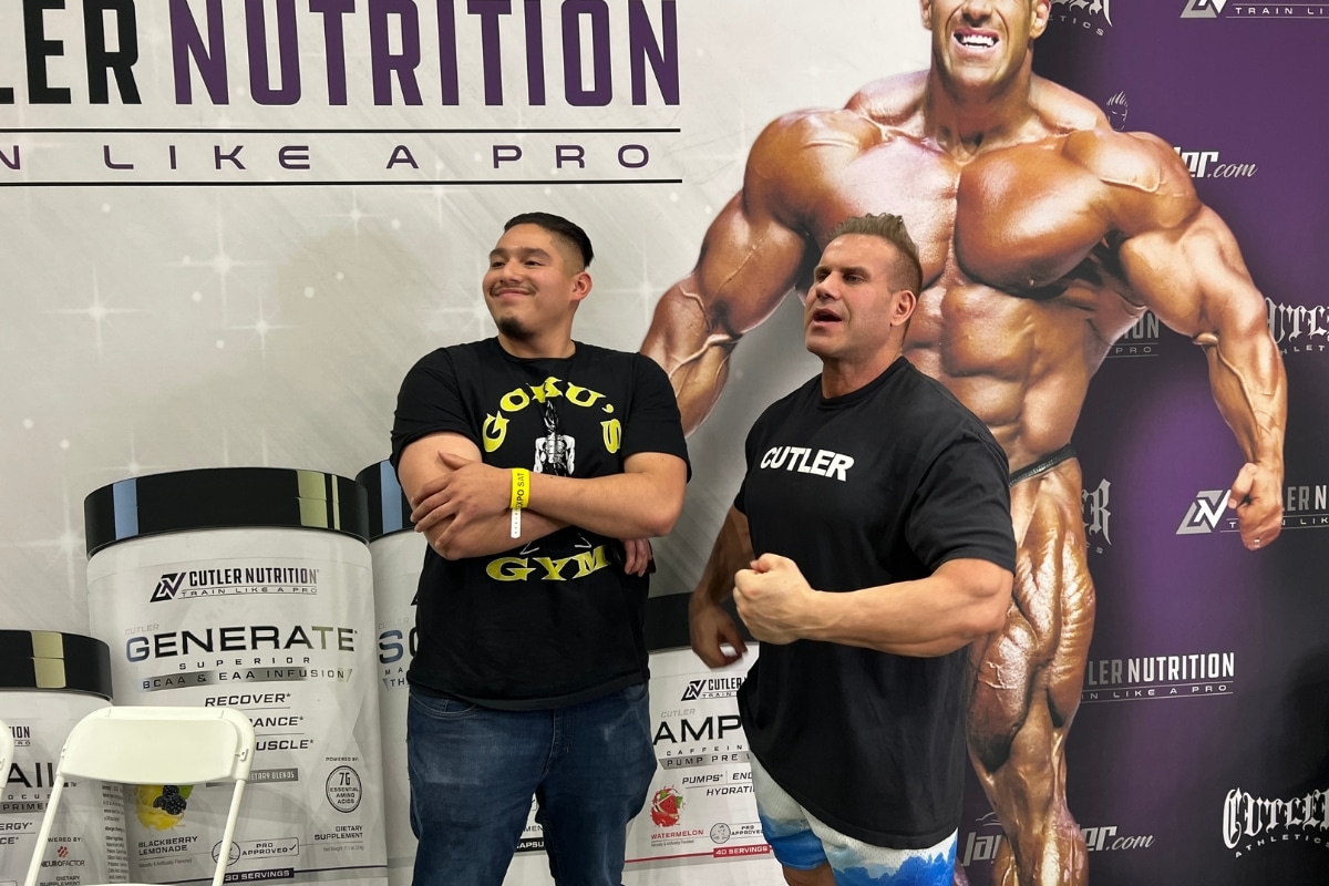 Bodybuilder Jay Cutler stands at a booth at TheFitExpo