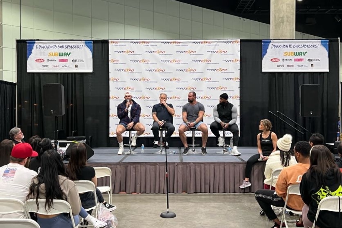 A panel addresses a crowd at TheFitExpo