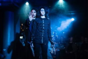 Actors dressed as characters from Edward Scissorhands perform onstage