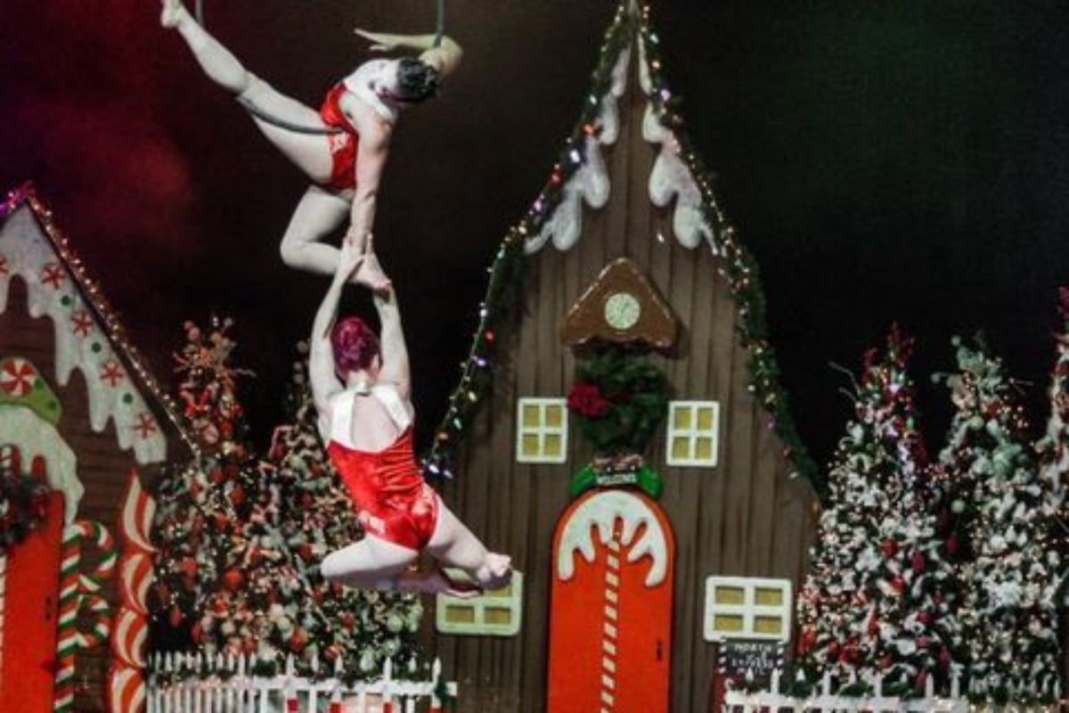 Santa's Circus performers do aerial acrobatics