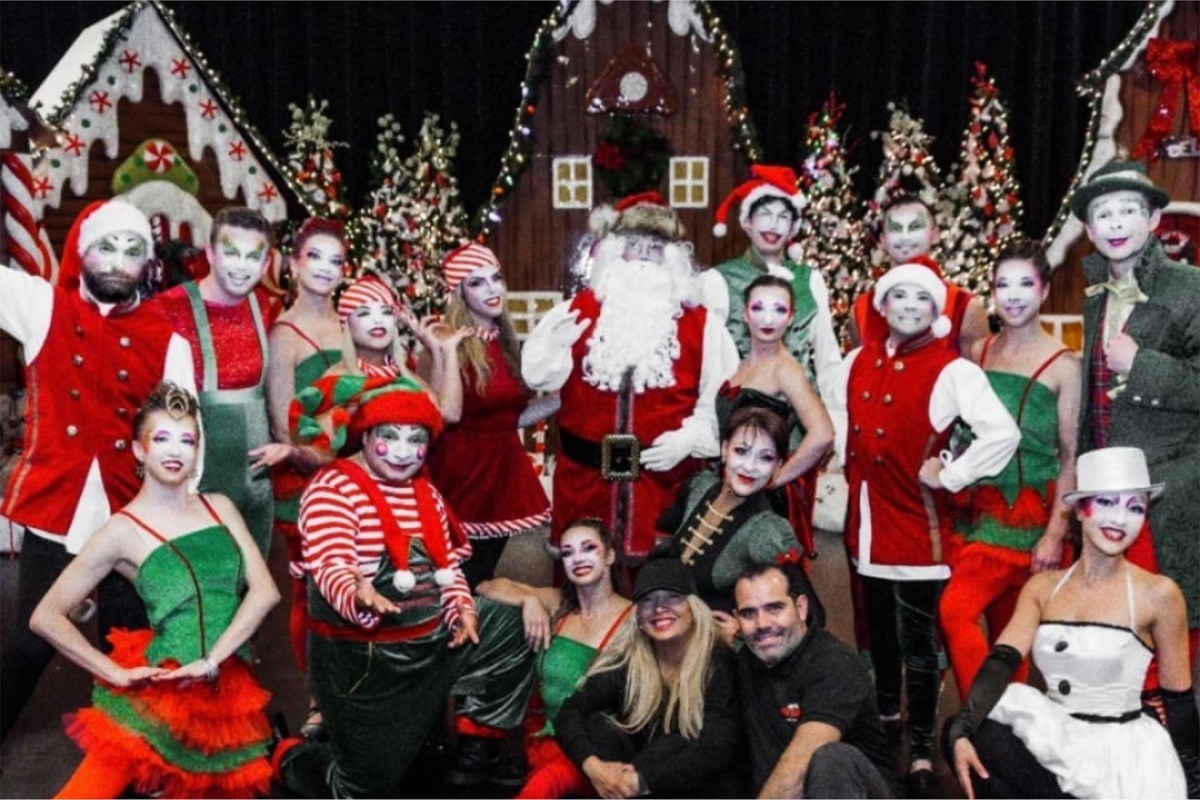 Santa's Circus performers pose onstage with Santa