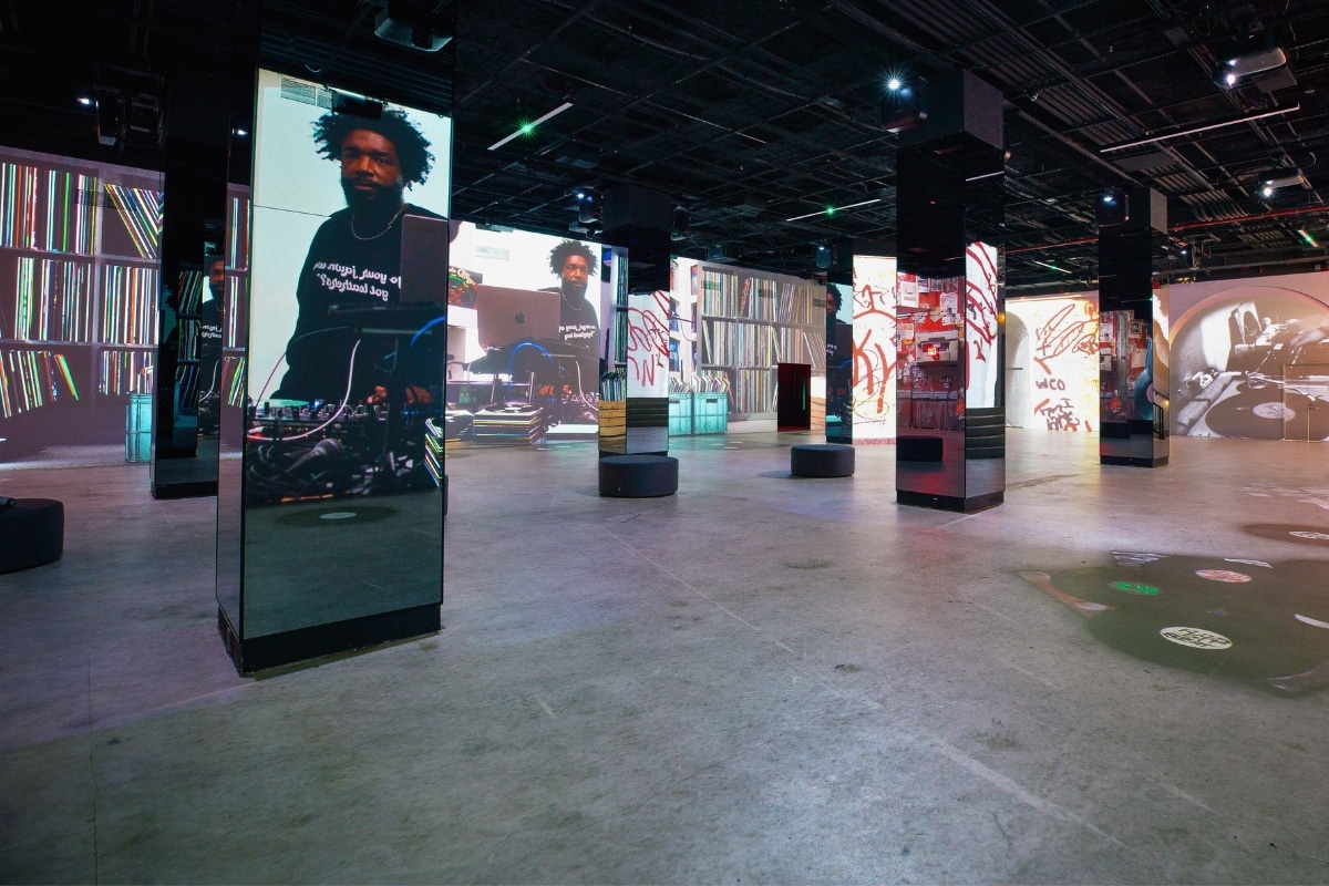 An exhibit of Hip Hop Til Infinity showing pictures of Questlove